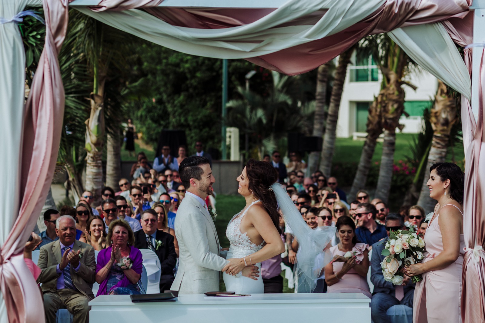 wedding-ceremony-bride-groom-moment-smile-ceremony-guest-marriot-vallarta-pier