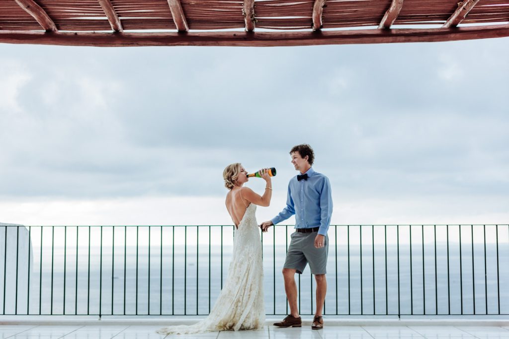 wedding bride groom champagne drink moment ocean sky Vallarta mismaloya 