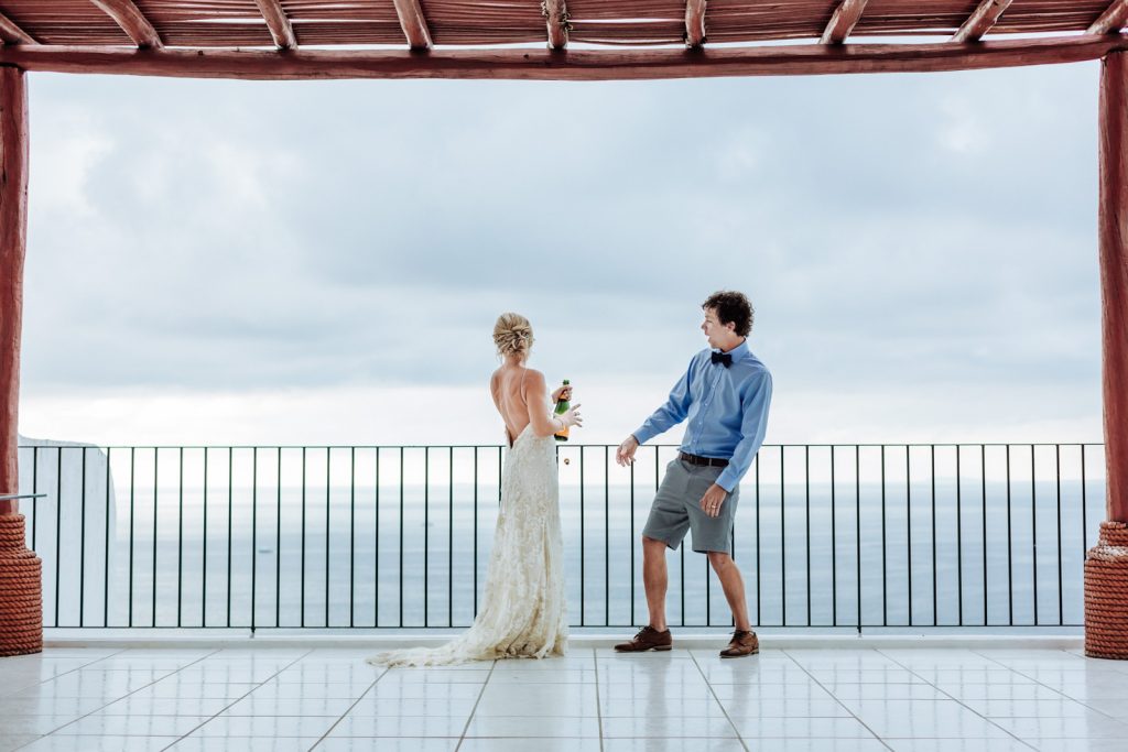 wedding bride groom champagne moment toast ocean sky Puerto Vallarta mismaloya 