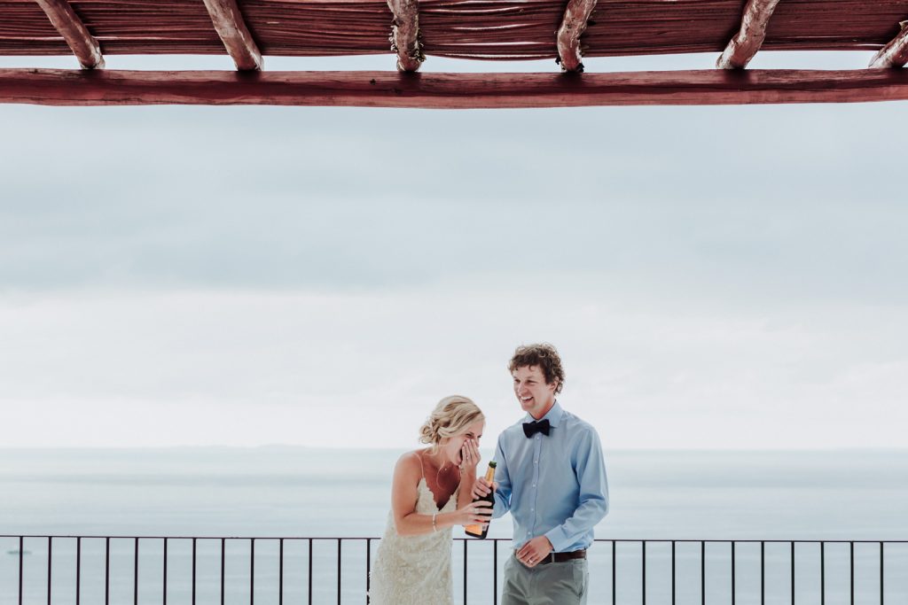 wedding bride groom champagne fun moment drink love ocean Vallarta 