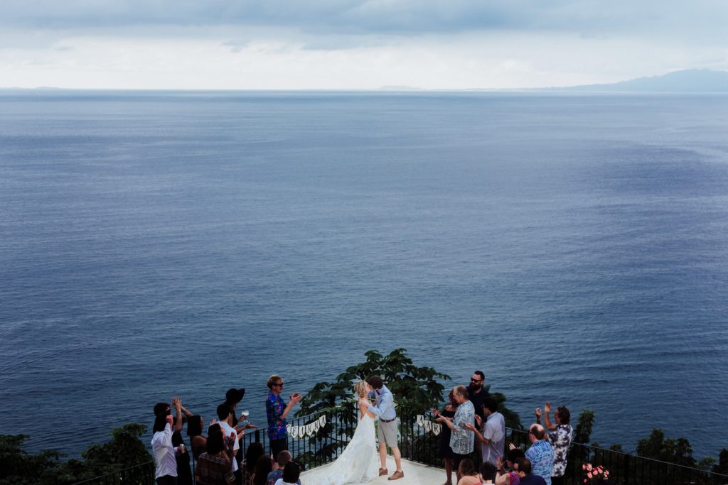 wedding ceremony kiss bride groom guest ocean Vallarta mismaloya tes beach sky