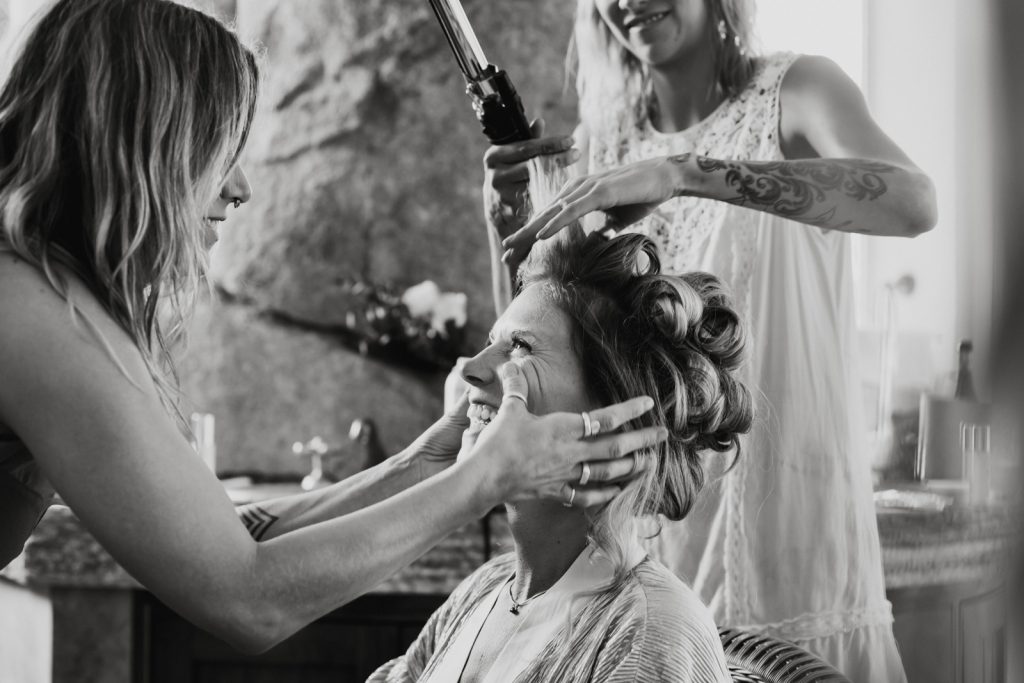 wedding girlfriends gettin ready smile hands on the face bride tattoos 