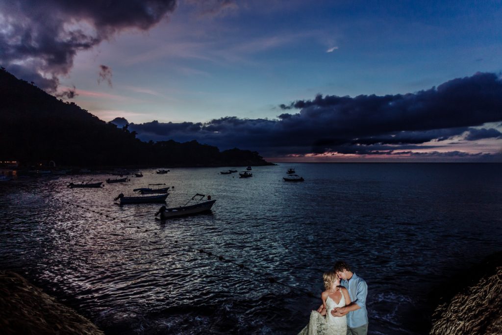 wedding bride groom hugs ocean sky sunset boat love pink sky 