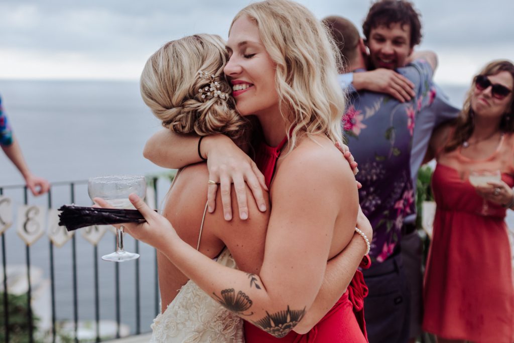 wedding ceremony bride sister hug smile love ocean moment Vallarta mismaloya 