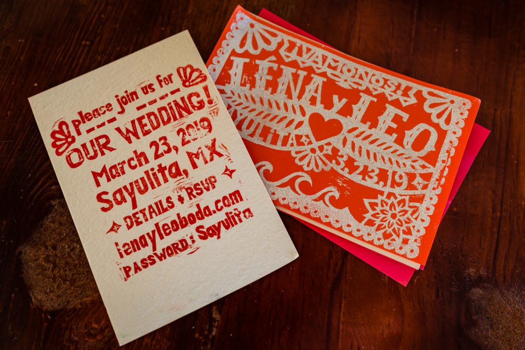 letters and invitation cards with bride and groom names 