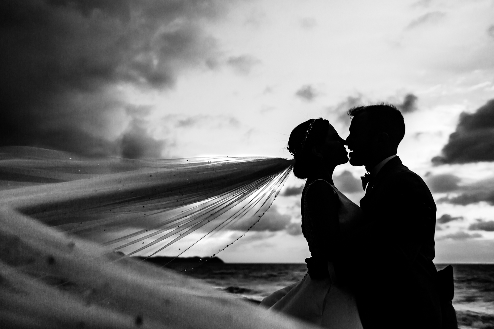 bride and groom on the beach during the sunset, san pancho destination wedding- veil