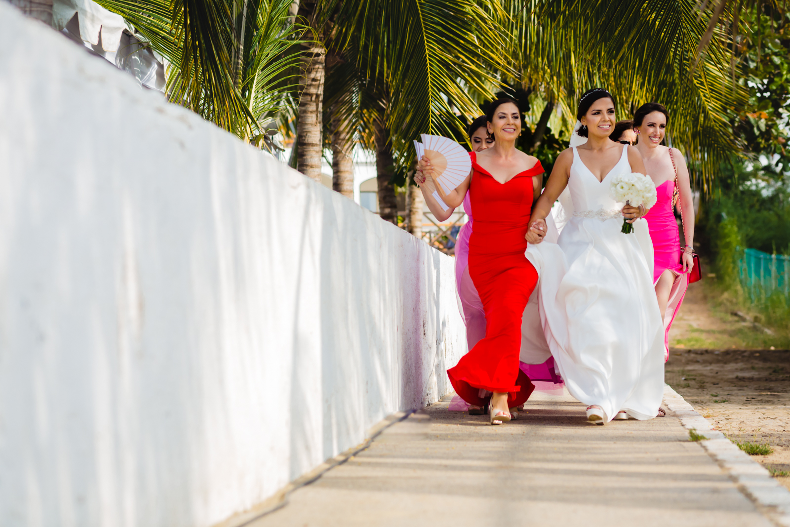 bride walk to the ceremony with family mum moment destination wedding 