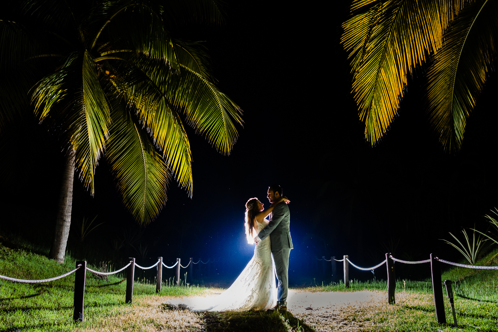 bride and groom with a back light on a garden