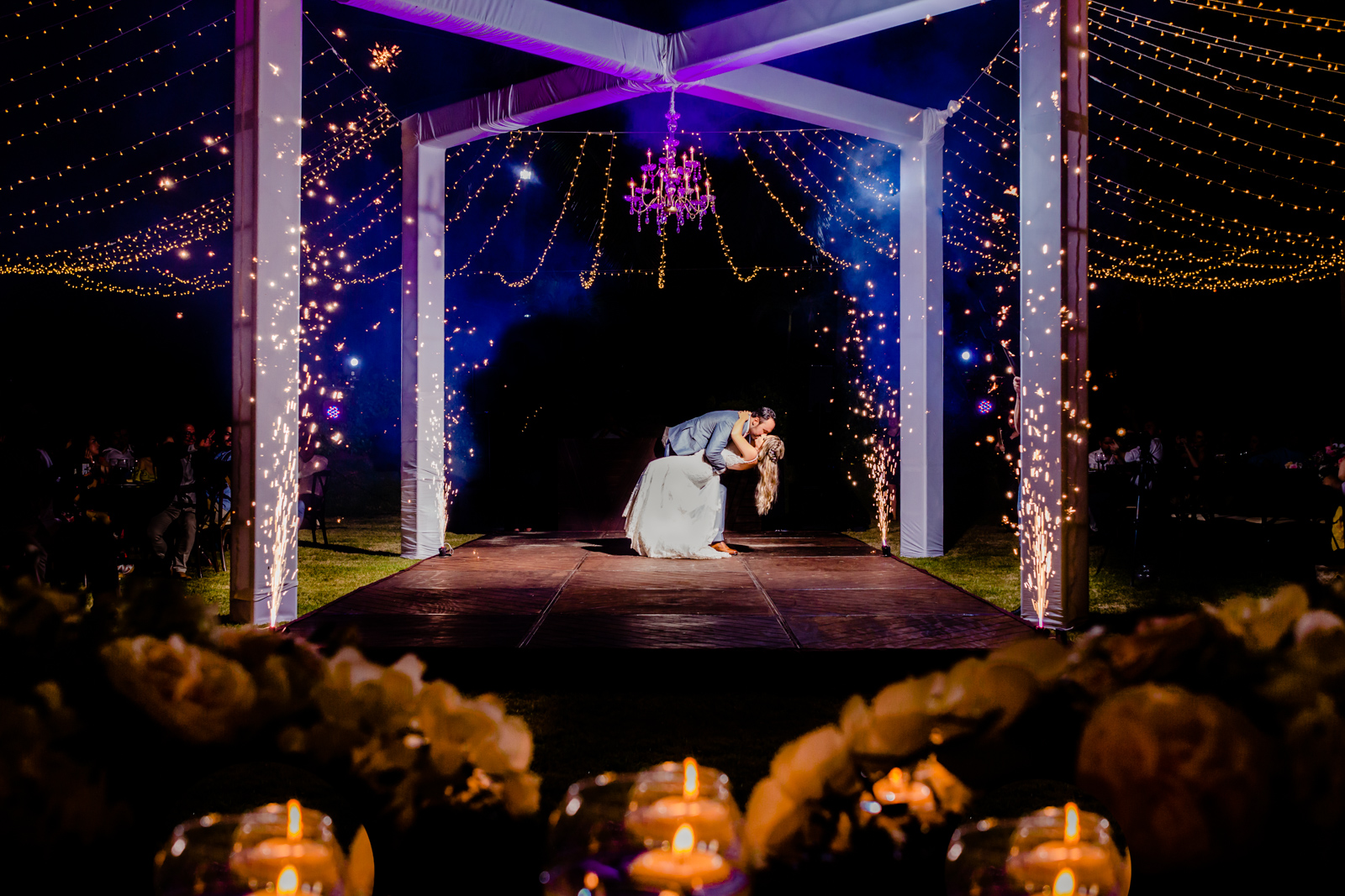 bride and groom kiss during their first dance 