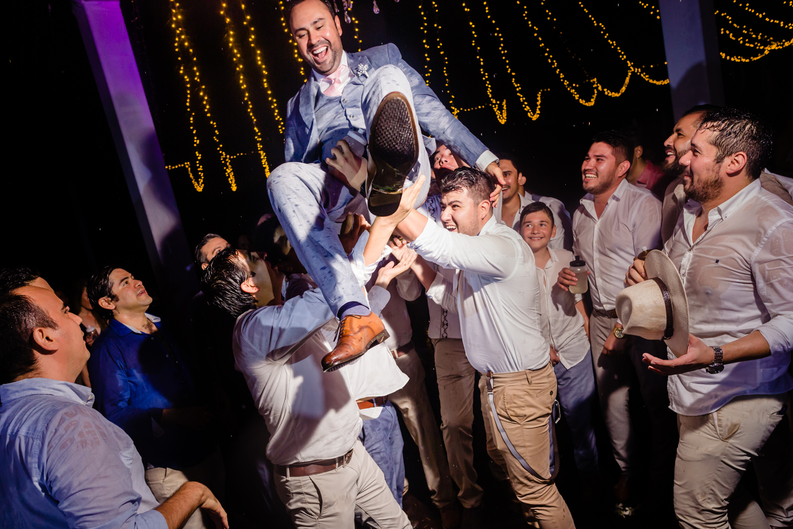 groom having fun with his friend on the party