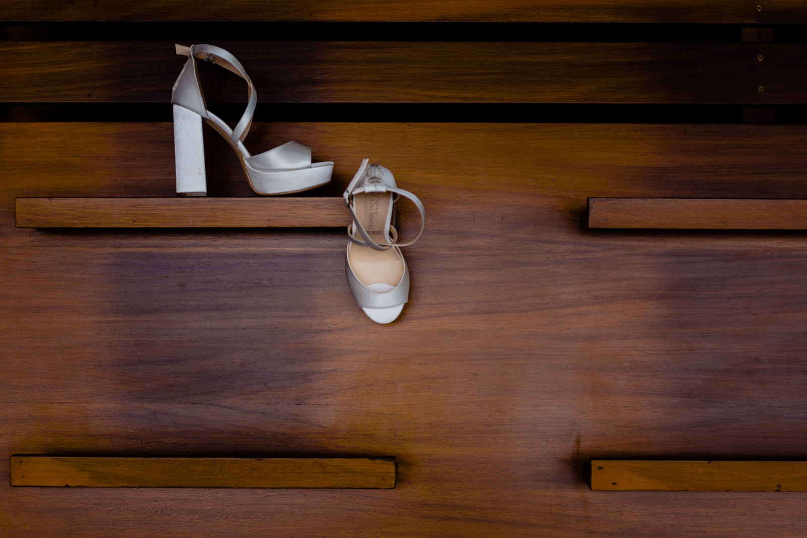 bride's shoes on a wood wall