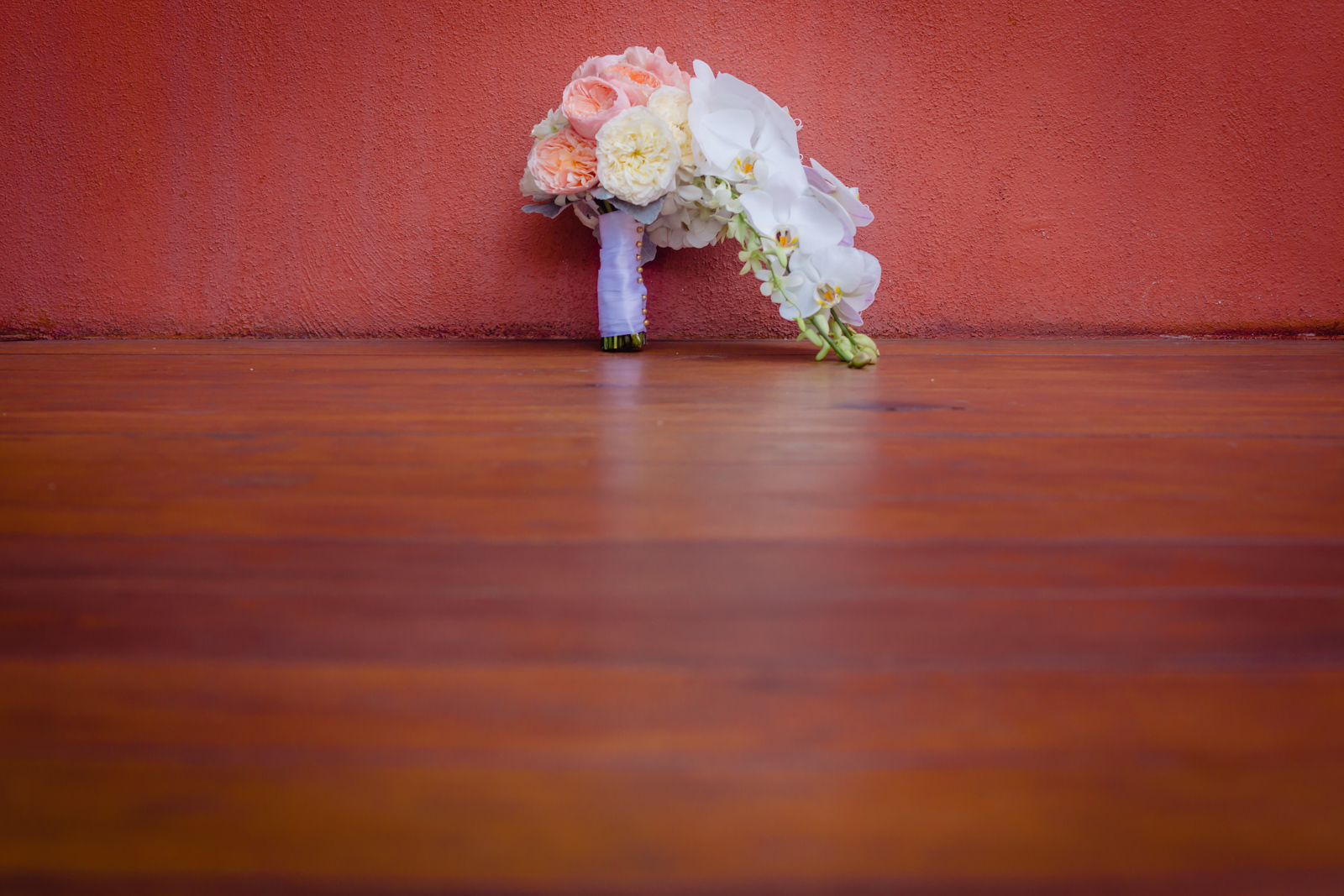 bouquet wedding on a red wall