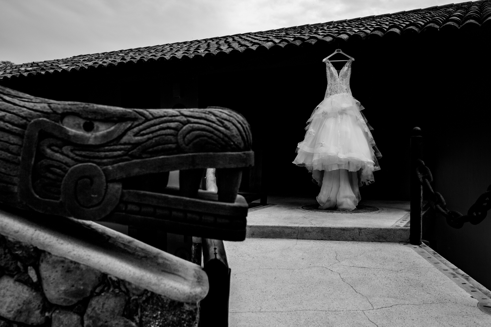 wedding dress hung on a roof with Mexican art 