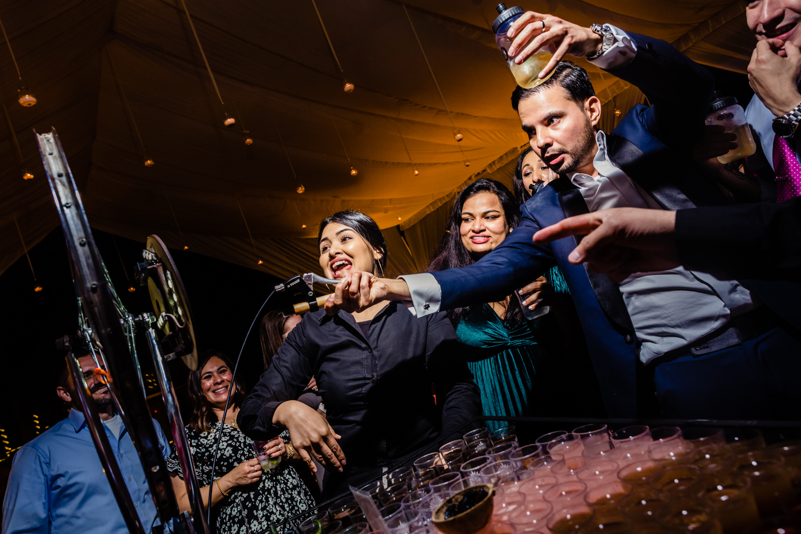 groom having fun during the party drinking and play a game 